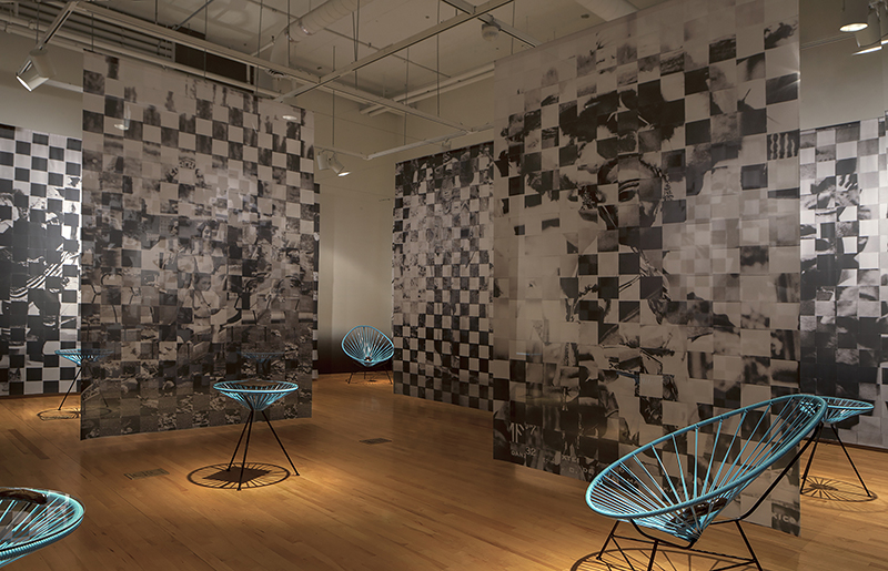 Maria Gaspar, Brown Brilliance Darkness Matter, 2016.  Installation detail at the National Museum of Mexican Art in Chicago. Woven Collage on Digitally Printed Dye Sub Fabric, White Stoneware, Cone 6, Oxidation, Brown Overglaze, Acapulco Furniture, 2016, Photo Credit: Sara Pooley. Courtesy of the artist.